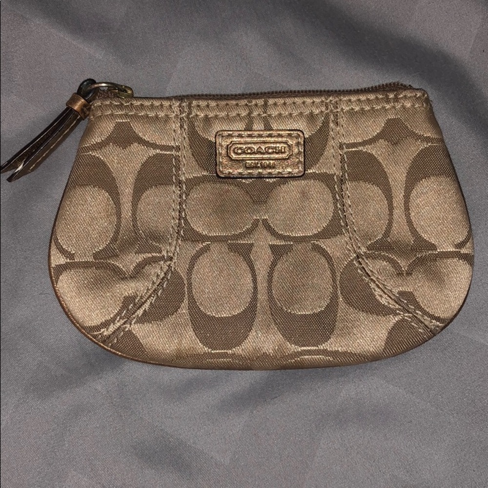 Coach brown and tan small zip up change purse